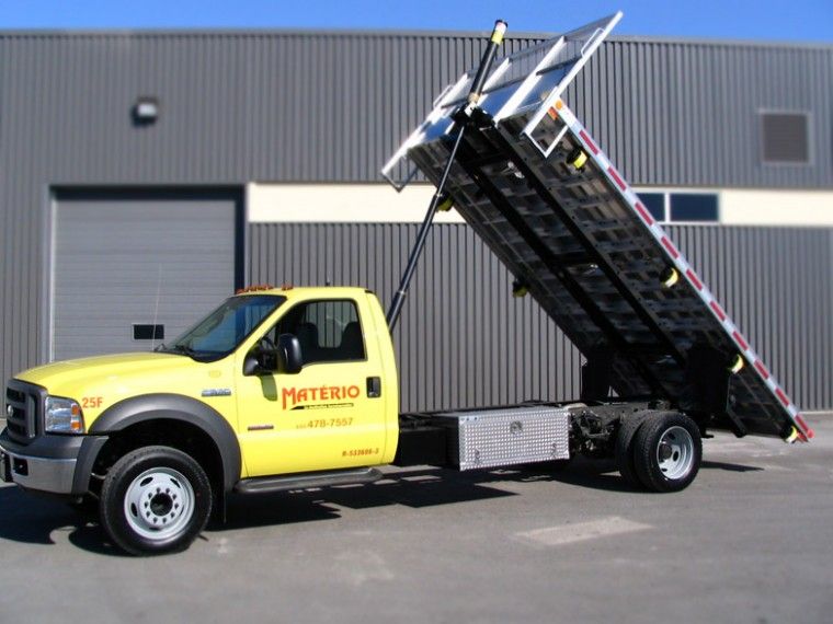yello flatbed truck with toolboxes